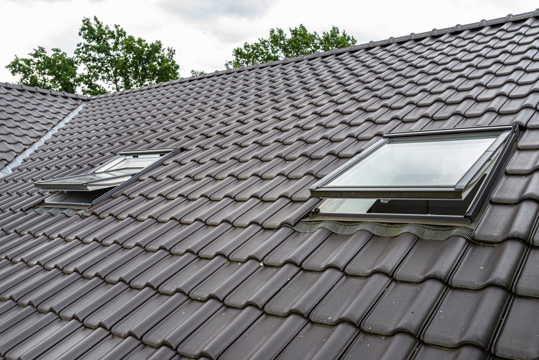 two open roof windows in the attic visible anthracite ceramic tiles .jpg